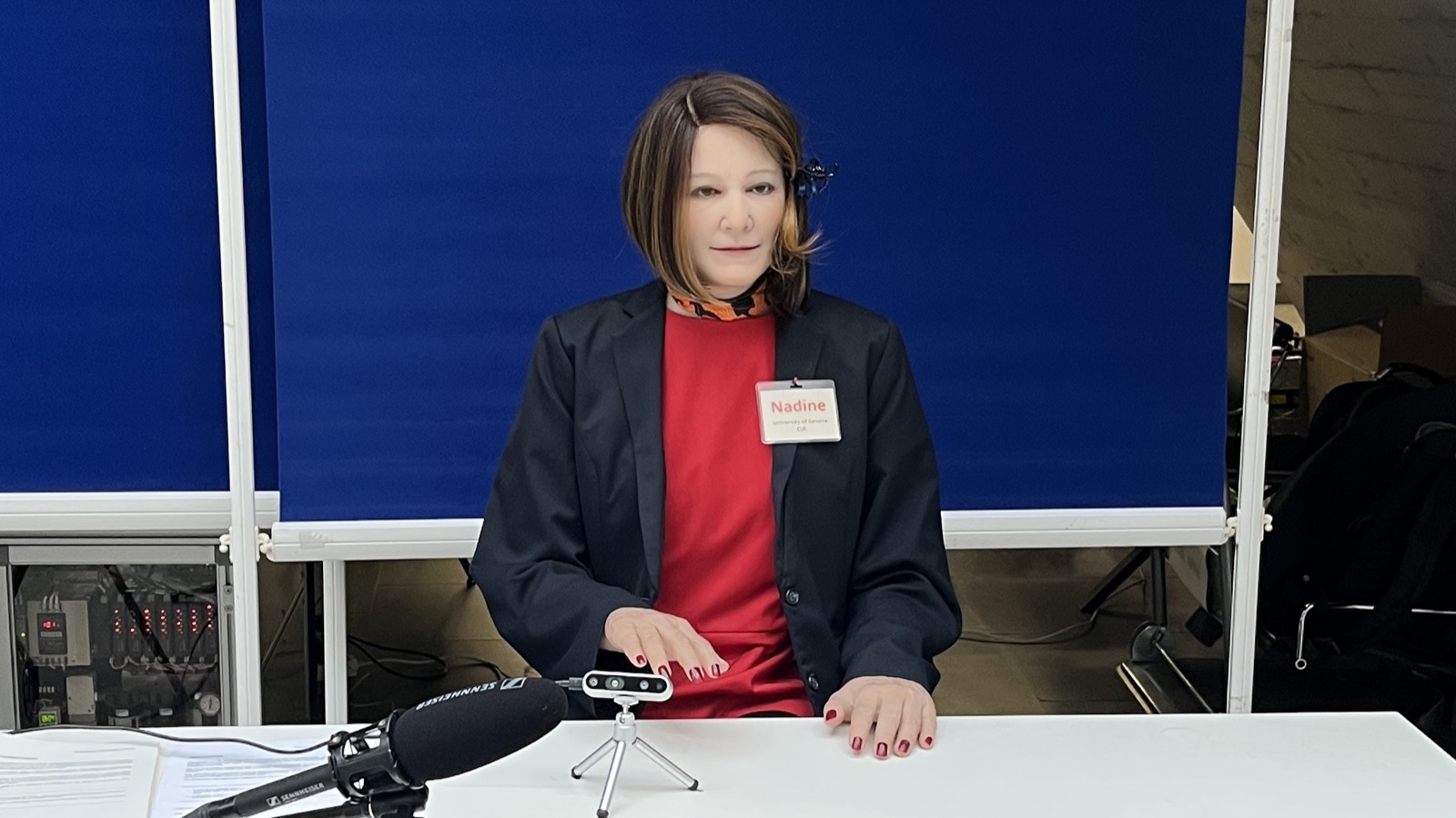 The humanoid robot Nadine seated at the table used for the one-on-one study
